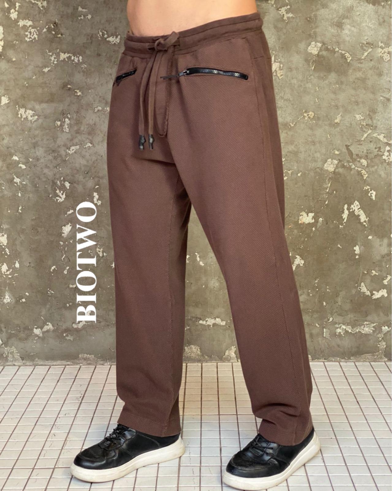 Calça colméia com bolso zíper